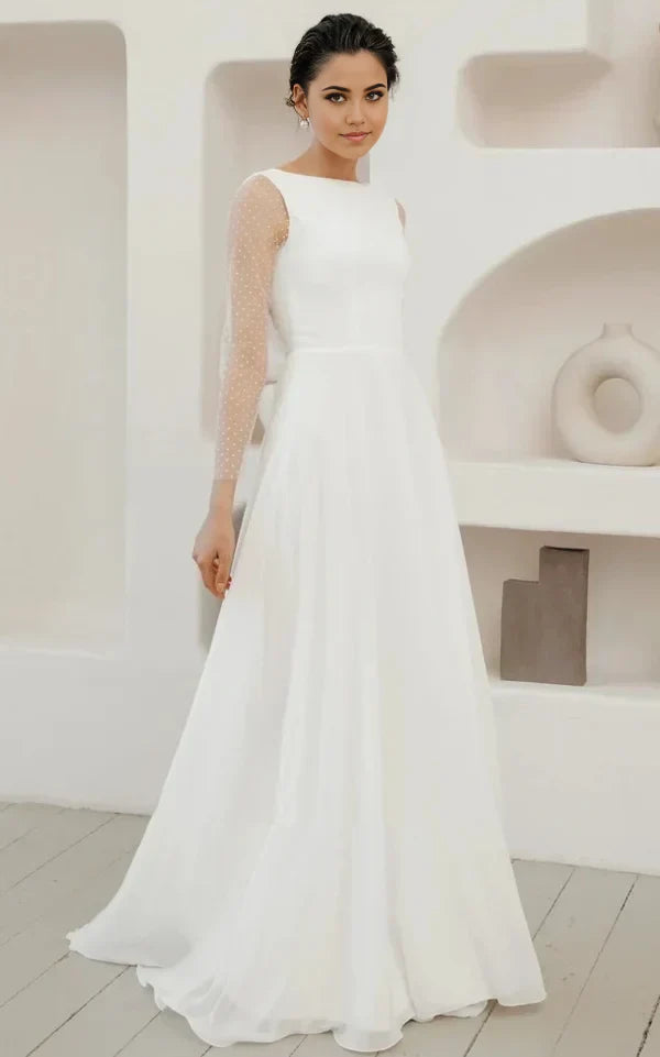 Vestido de novia minimalista de gasa con mangas abullonadas y botones de perla en la espalda baja